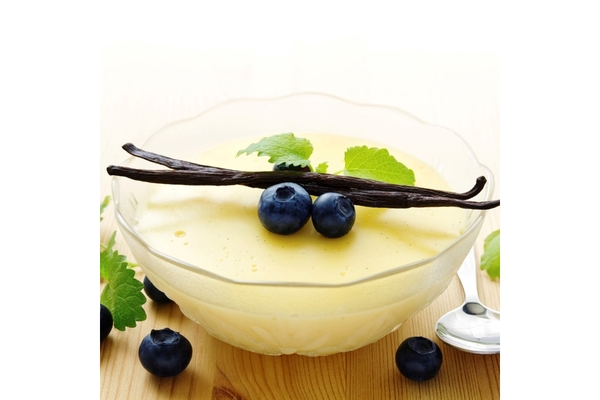 Vanilla pudding topped with fresh blueberries and vanilla pods.